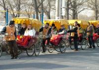 Foreign Visitors Visit Beijing Alley by Rickshaw