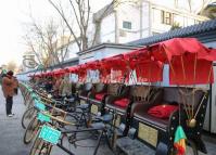 The Rickshaws are Plying for Hire in Beijing Hutongs