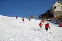 Visitors Skiing in Beijing Snow World Ski Resort