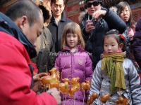 Kids in Front of  A Sugar Figurines Stall