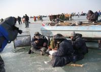 Several Fishermen are Rest on the Ice