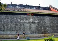 Two People Walking along the Outside Wall of Chen Clan Academy