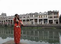 A Girl Poses at the Background of Chikan Old Town