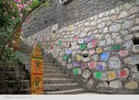 The Dongba Symbols in A Wall of Lijiang Old Town