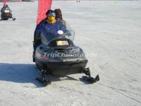 A Tourist Enjoy Snowmobiling in Erlongshan Ski Resort 