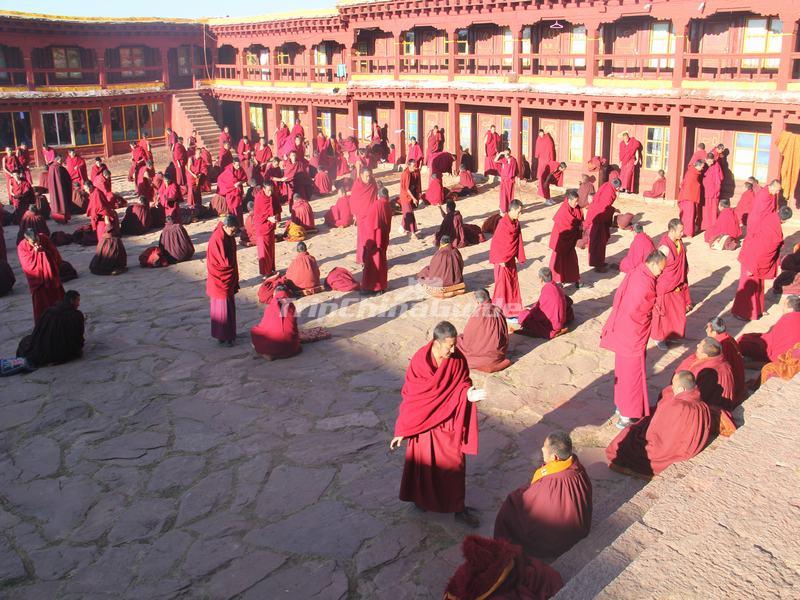 Lamas in Ganden Thubchen Choekhorling Monastery Courtyard