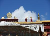 Two Lamas Play Tibetan Horns on the Roof of the Jokhang Temple