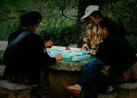 People Play Mahjong at Lijiang Black Dragon Pool Park