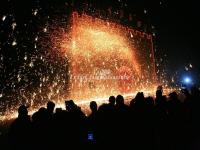 Tourists Watch Molten Iron Fireworks Show