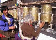 Two Prayers Turn the Prayer Wheels in Potala Palace