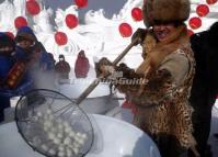 A Local Man is Cooking Dumplings During the Snow Art Expo on Sun Island