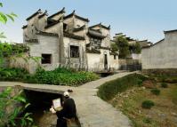 A Man Sketching at Xidi Village Huangshan City