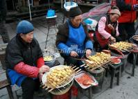 The Local Women Sell Snacks in Xiling Snow Mountain