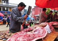 The Butcher is Chopping Meat. 