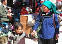 A Woman and Her Kid at Yuanyang Shengcun Market 